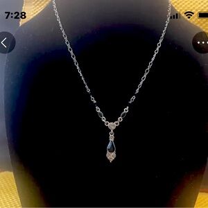 Silver tone necklace with black & clear gems